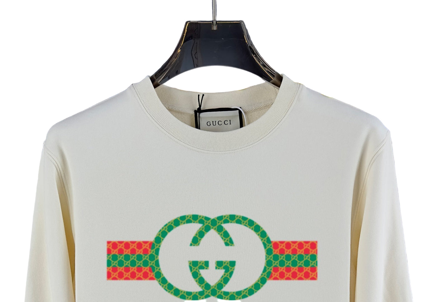 sweatshirt with graphic design on a hanger in a store setting