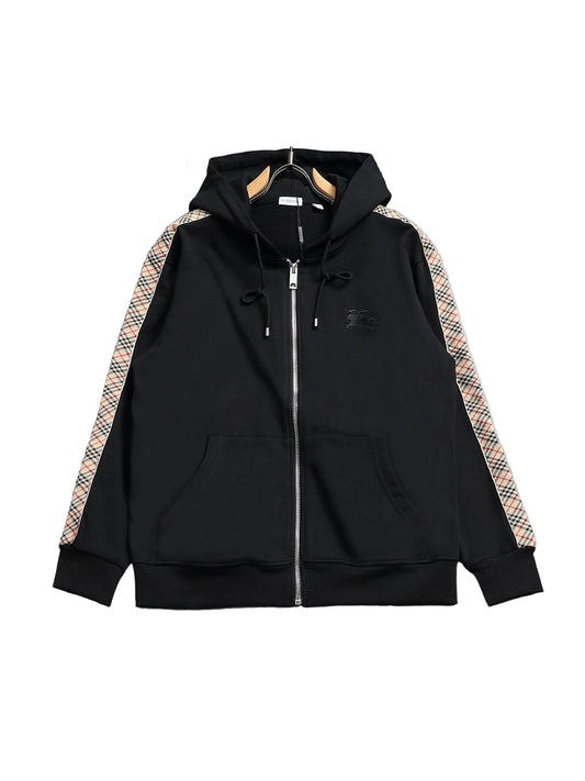 Black hoodie with plaid accents on a gray surface