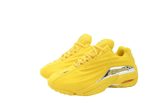 Yellow sneakers with a metallic accent on a white background