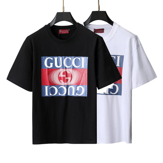 Black and white t-shirts on hangers with a gray and white geometric background