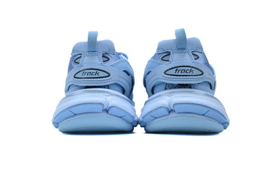 Pair of blue sandals with 'track' graphic on a white background