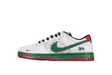 White sneaker with green and red accents on a black background