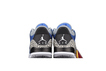 sneakers with black, blue, and white design on a black background