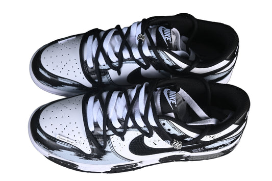 Black and white sneakers on a black grid background