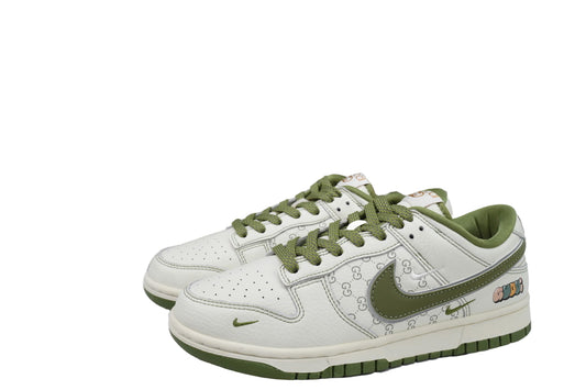 White sneakers with green accents and a box in the background