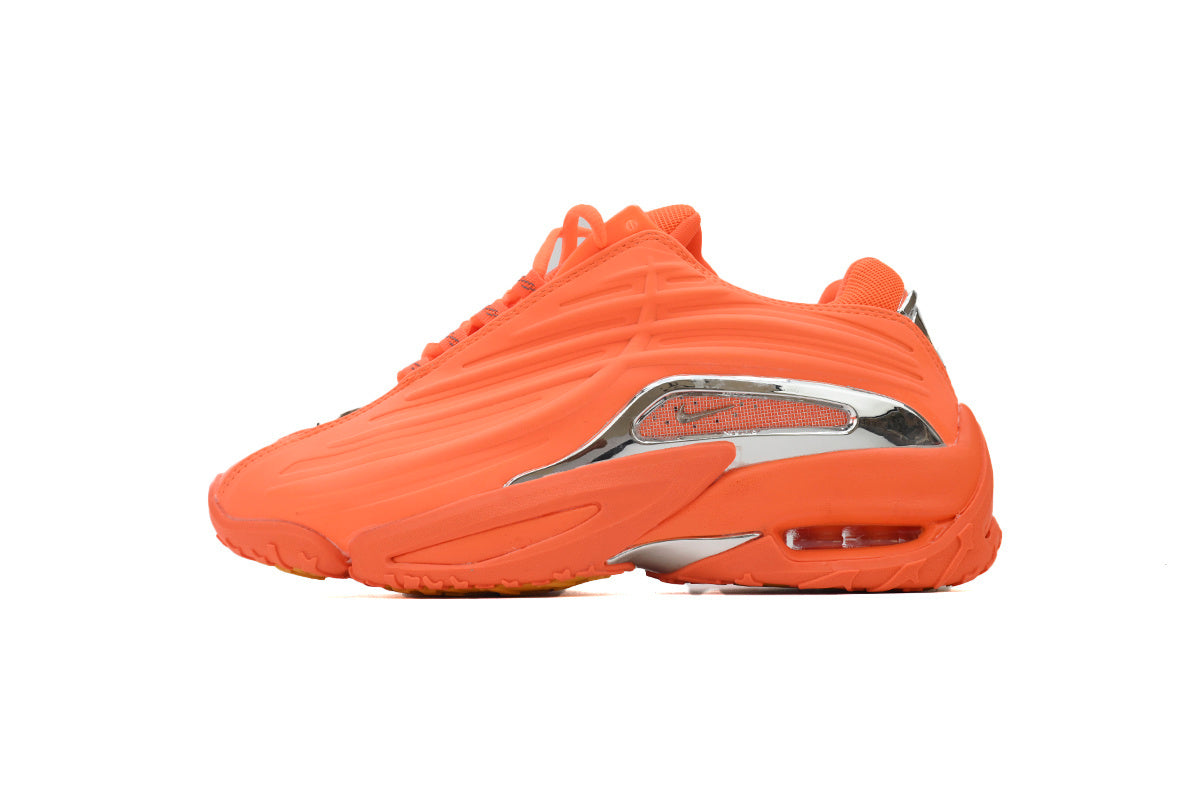 Orange sneaker with silver accents on a white background