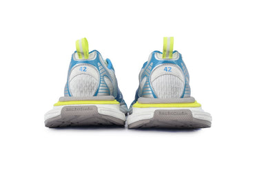 Pair of blue and gray running shoes with yellow accents on a white background