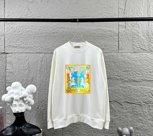 White sweatshirt with colorful graphic design hanging on a gray tiled wall.