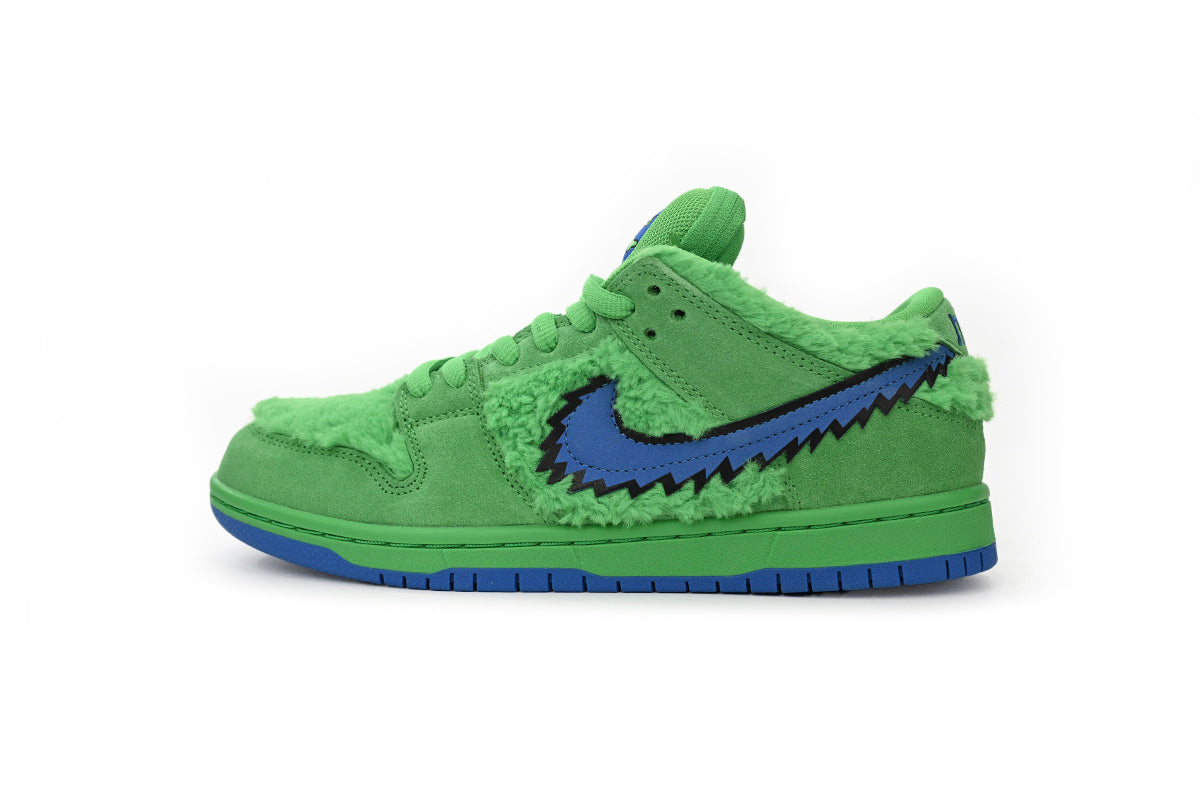 Green sneaker with blue graphicon a white background