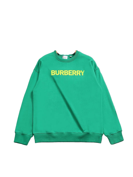 Green sweatshirt on a hanger against a gray background