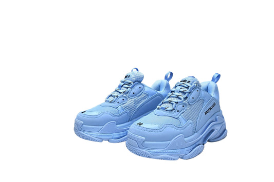 Blue  sneakers with a black on a white background
