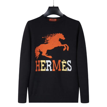 Black sweater with orange horse graphic and 'Hermès' text on a gray background