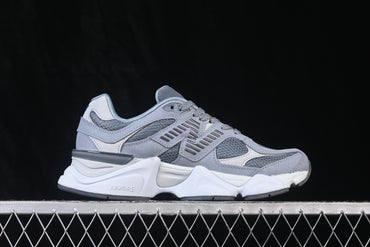 Classic gray athletic sneakers featuring a layered mesh and synthetic upper, cushioned midsole, supportive lace-up construction, and durable rubber outsole. Designed for everyday casual wear, walking, and streetwear styling.