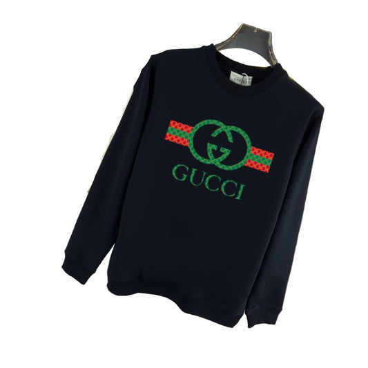 Black sweatshirt with graphic on a hanger against a store background