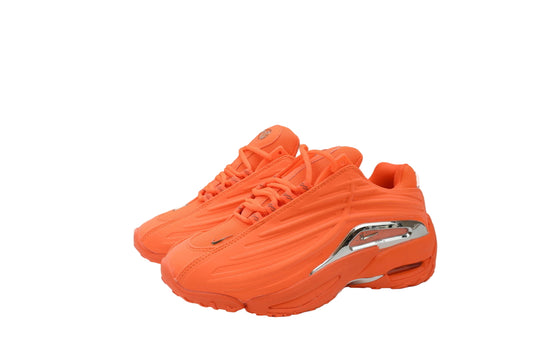 Orange sneakers with a silver accent on a white background