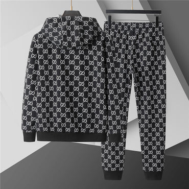 Black hoodie and pants with white pattern on a gray background