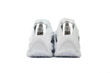 White sneakers with metallic graphic on a white background