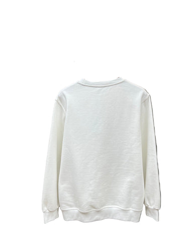 White sweatshirt on a hanger against a neutral background