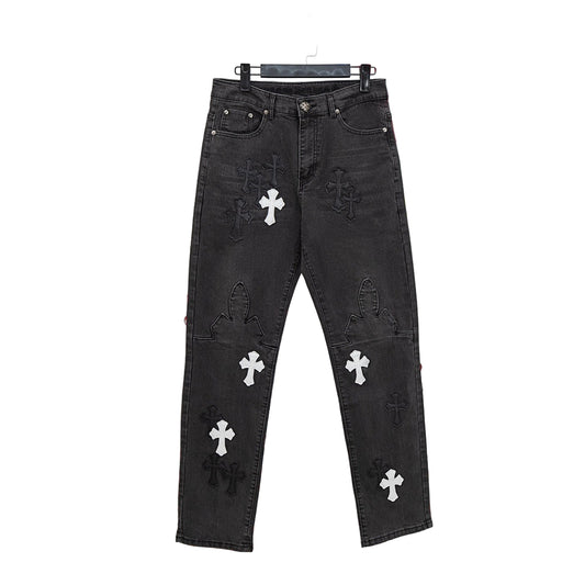 Black jeans with white cross patterns on a colorful