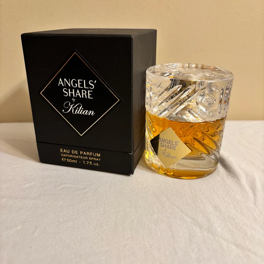 eau de parfum bottle and packaging on a beige background