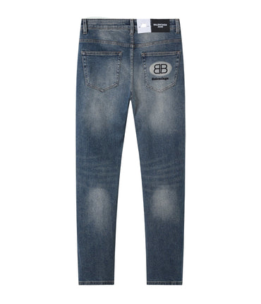 Blue jeans with a graphic displayed in a frame on a decorative background