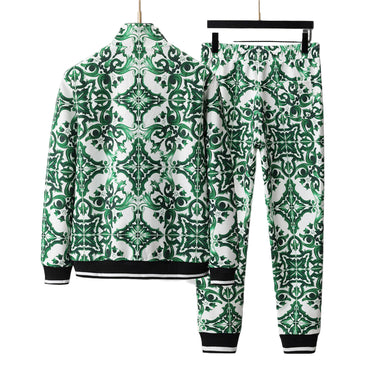 Green and white patterned jacket and pants set on a gray background