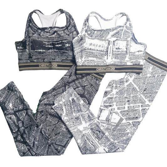 black and white two-piece activewear set featuring a bold all-over map-style print. I