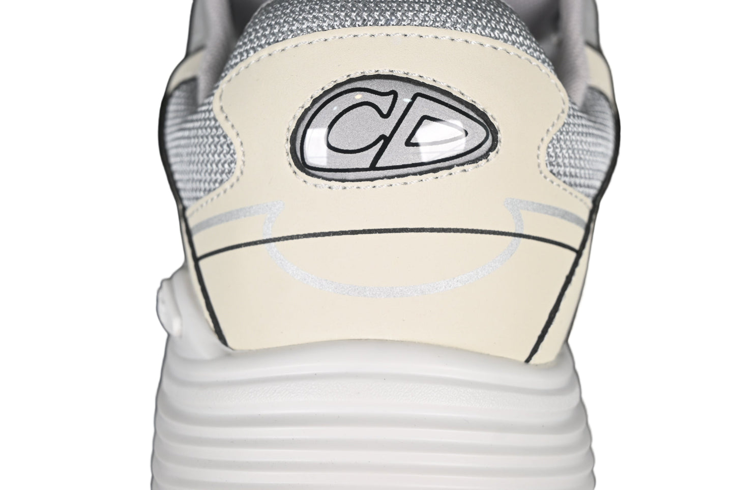 Close-up of a sneaker with a graphicon the side against a black background
