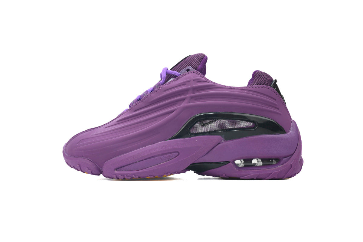 Purple sneaker with a white background