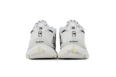 White  sneakers with brand logo on a white background