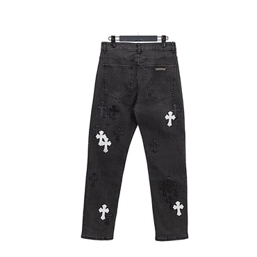 Black distressed jeans with white cross designs