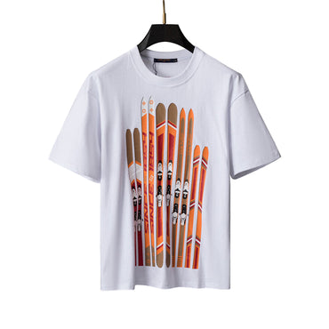 White t-shirt with orange and brown graphic design on a gray background