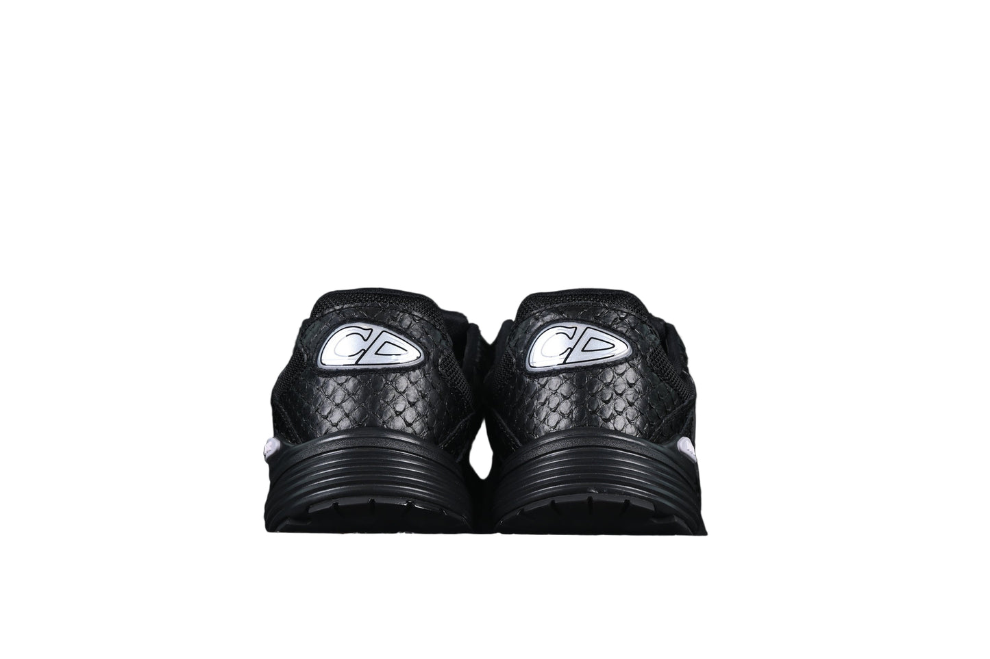 Black sneakers with a graphic on a black background