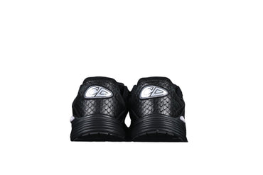 Black sneakers with a graphic on a black background