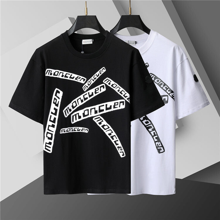 Black and white t-shirts with 'moncler' branding on a gray background