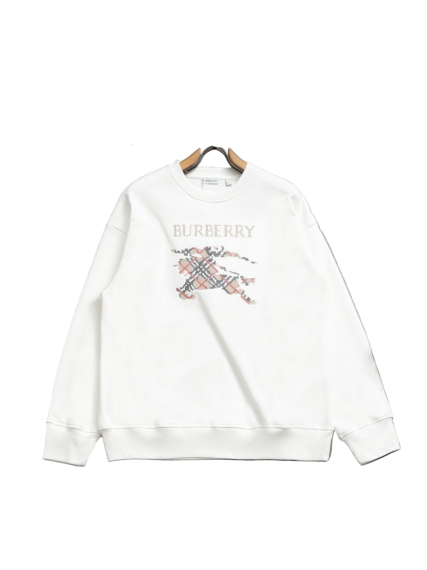 White  sweatshirt on a hanger against a gray background