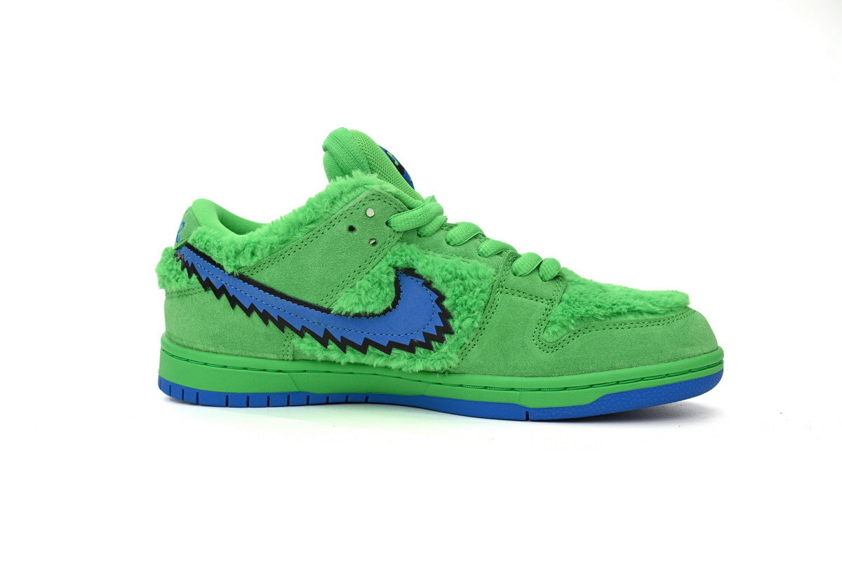 Green sneaker with blue graphic on a white background