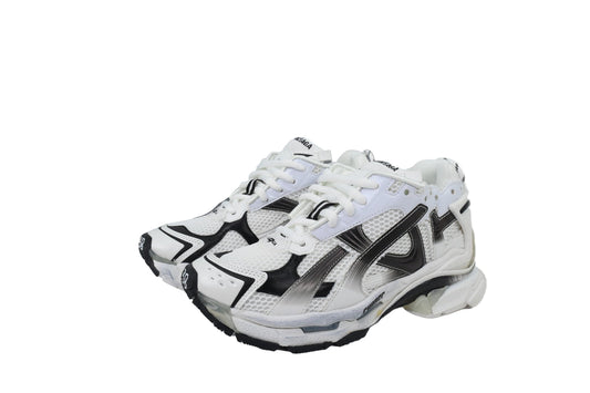 White and black  sneakers with a matching box on a white background