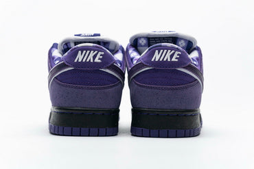 Purple sneakers with black soles on a white background
