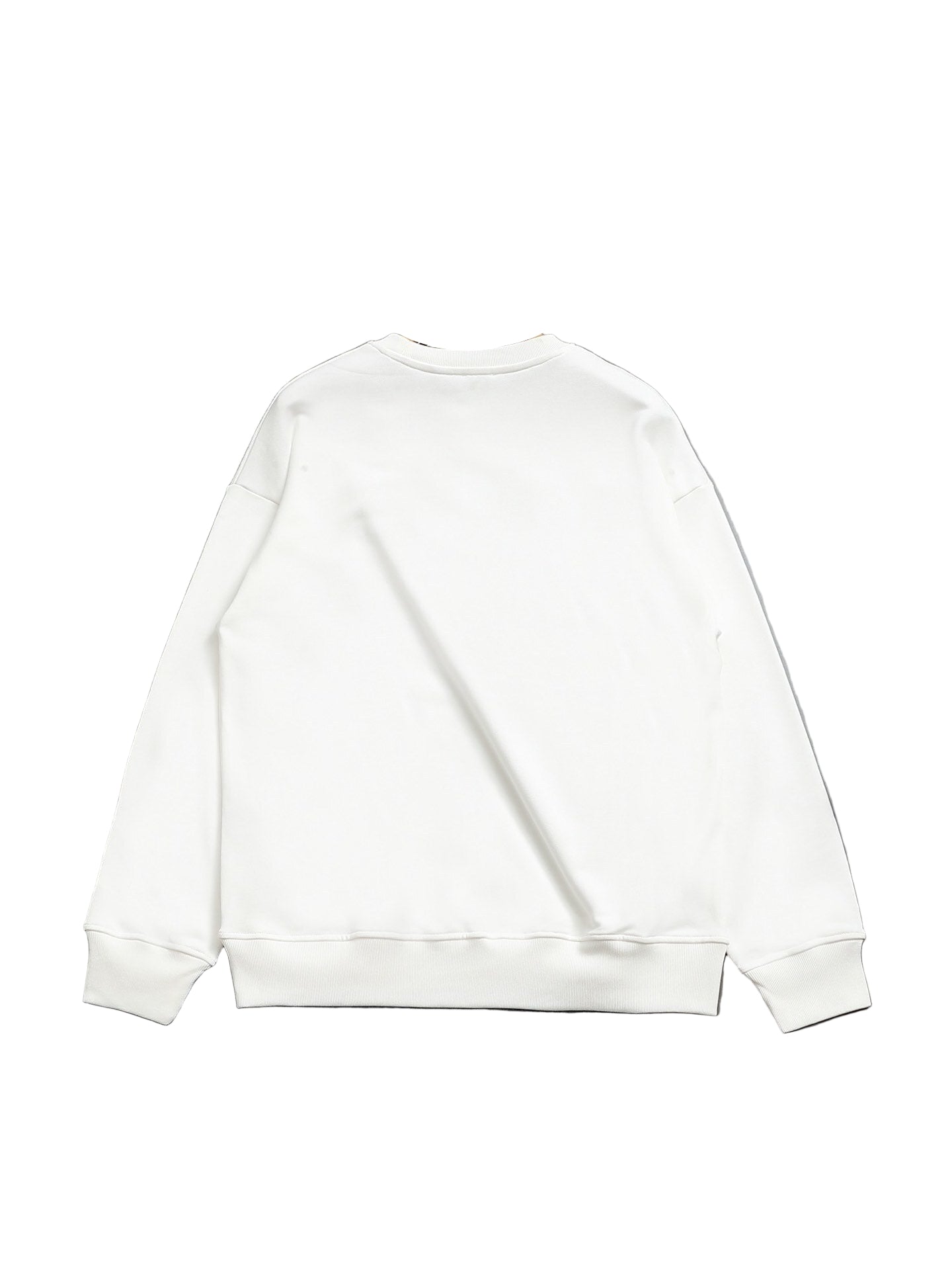 White sweatshirt on a hanger against a gray floor and wall.