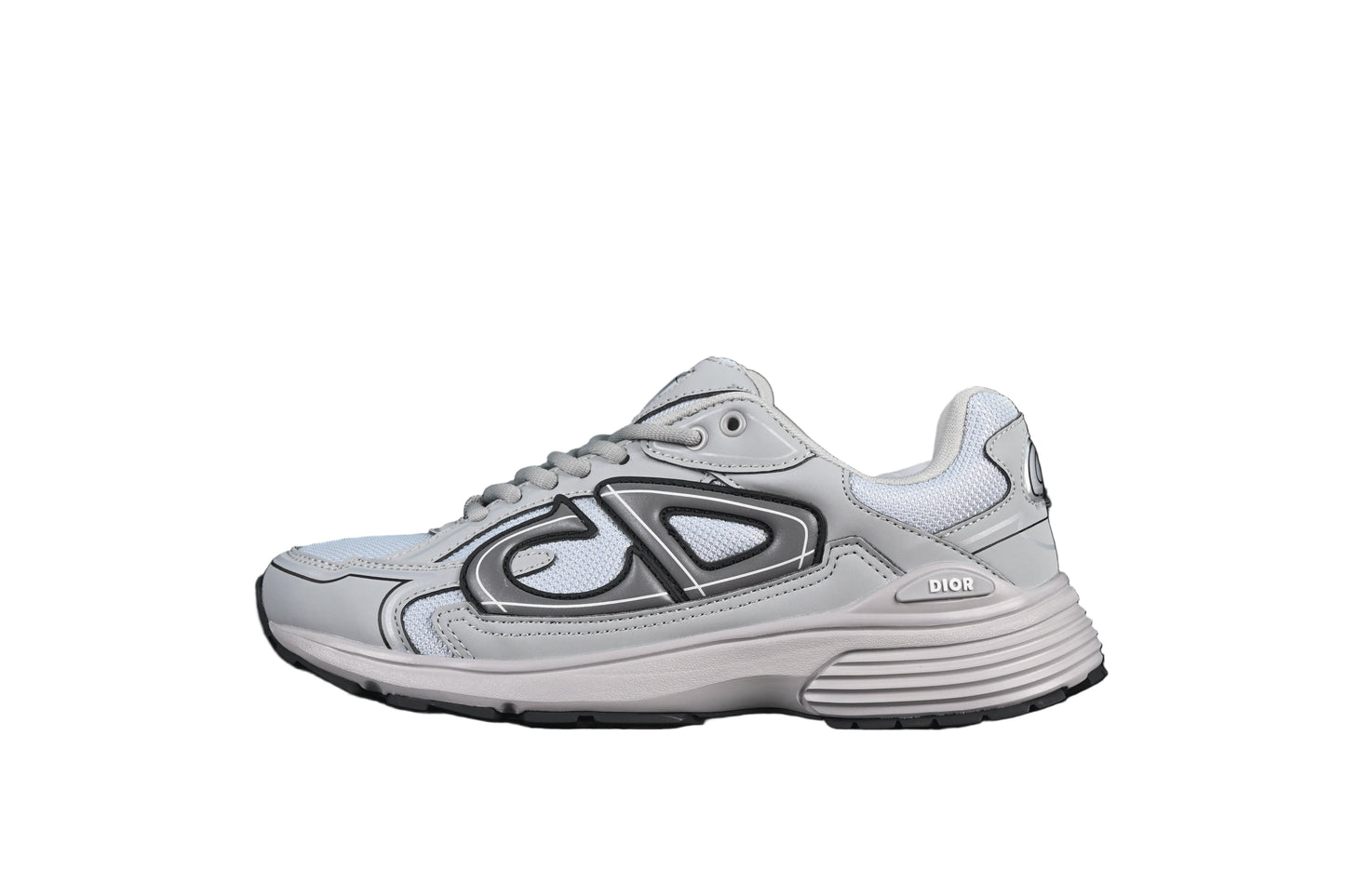 White running shoe with black on a black background