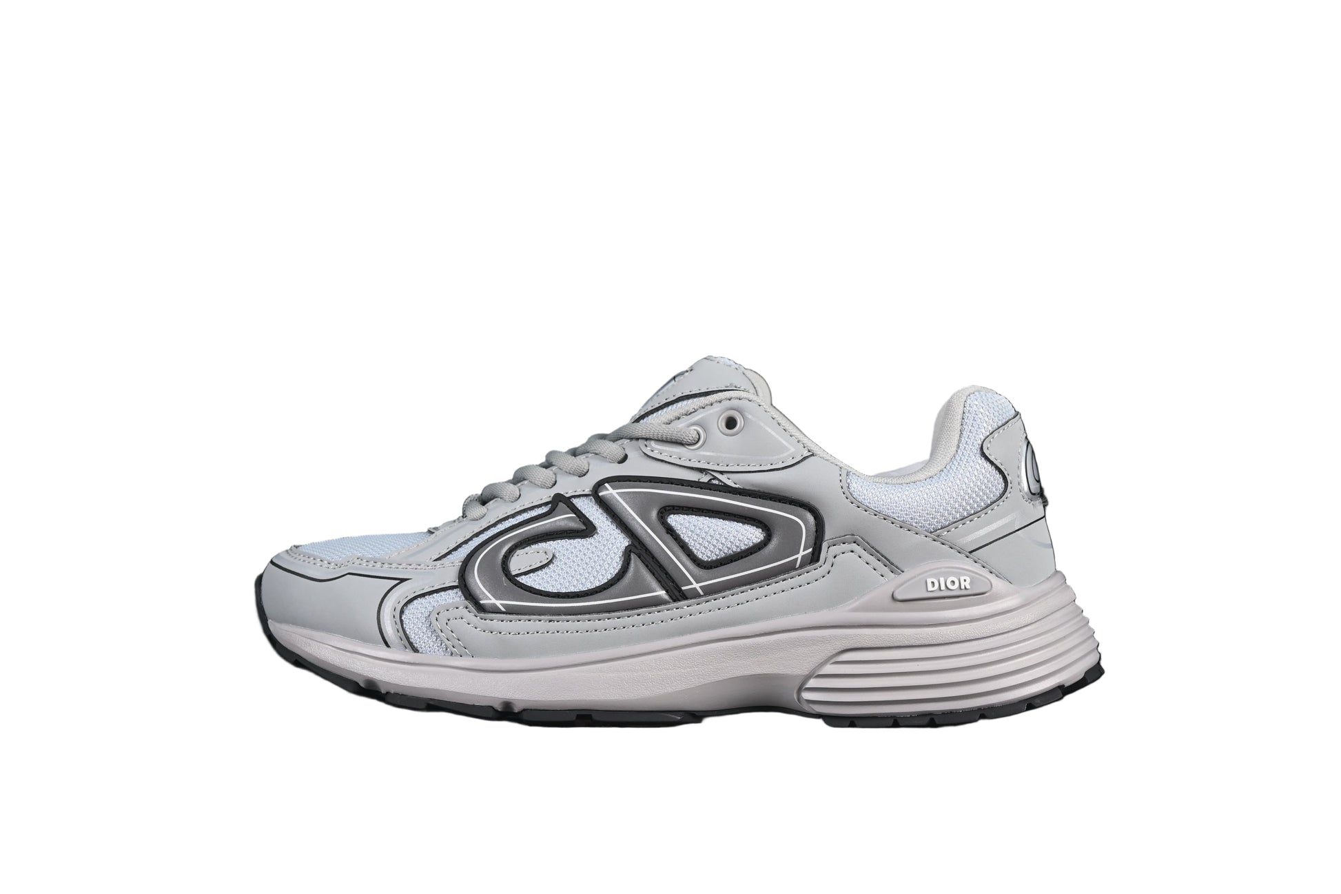 White running shoe with black on a black background