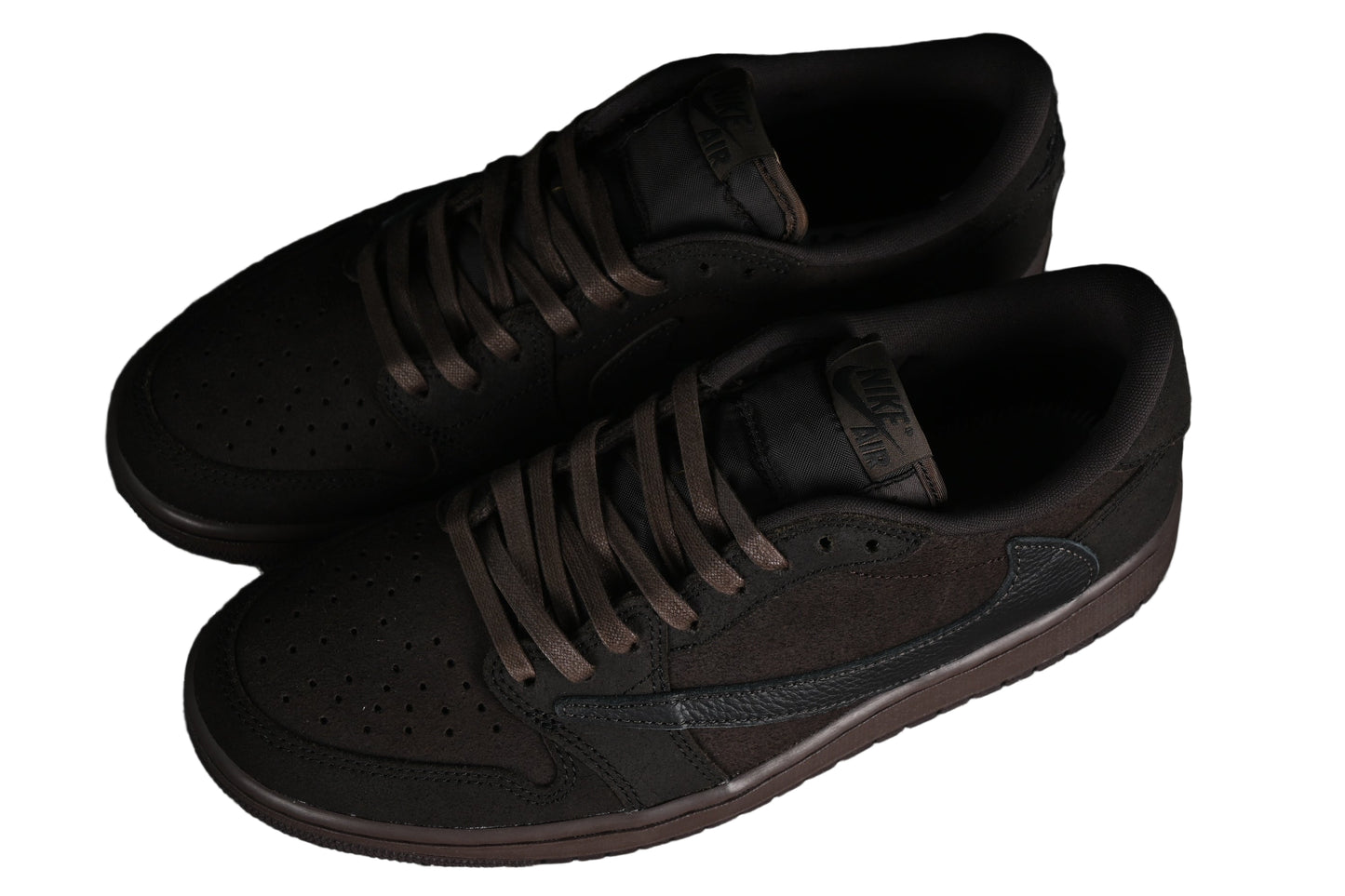 Pair of black sneakers on a white background