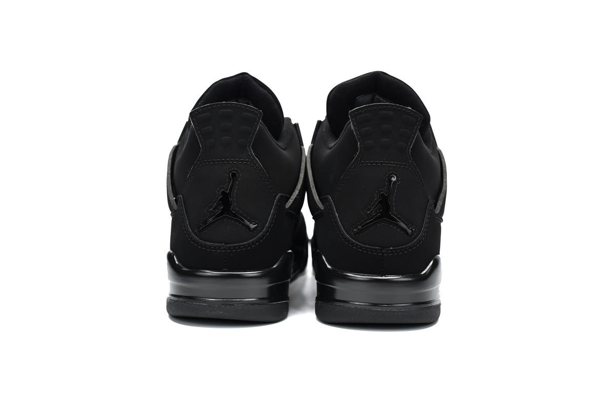 Black sneakers shown from the back on a white background