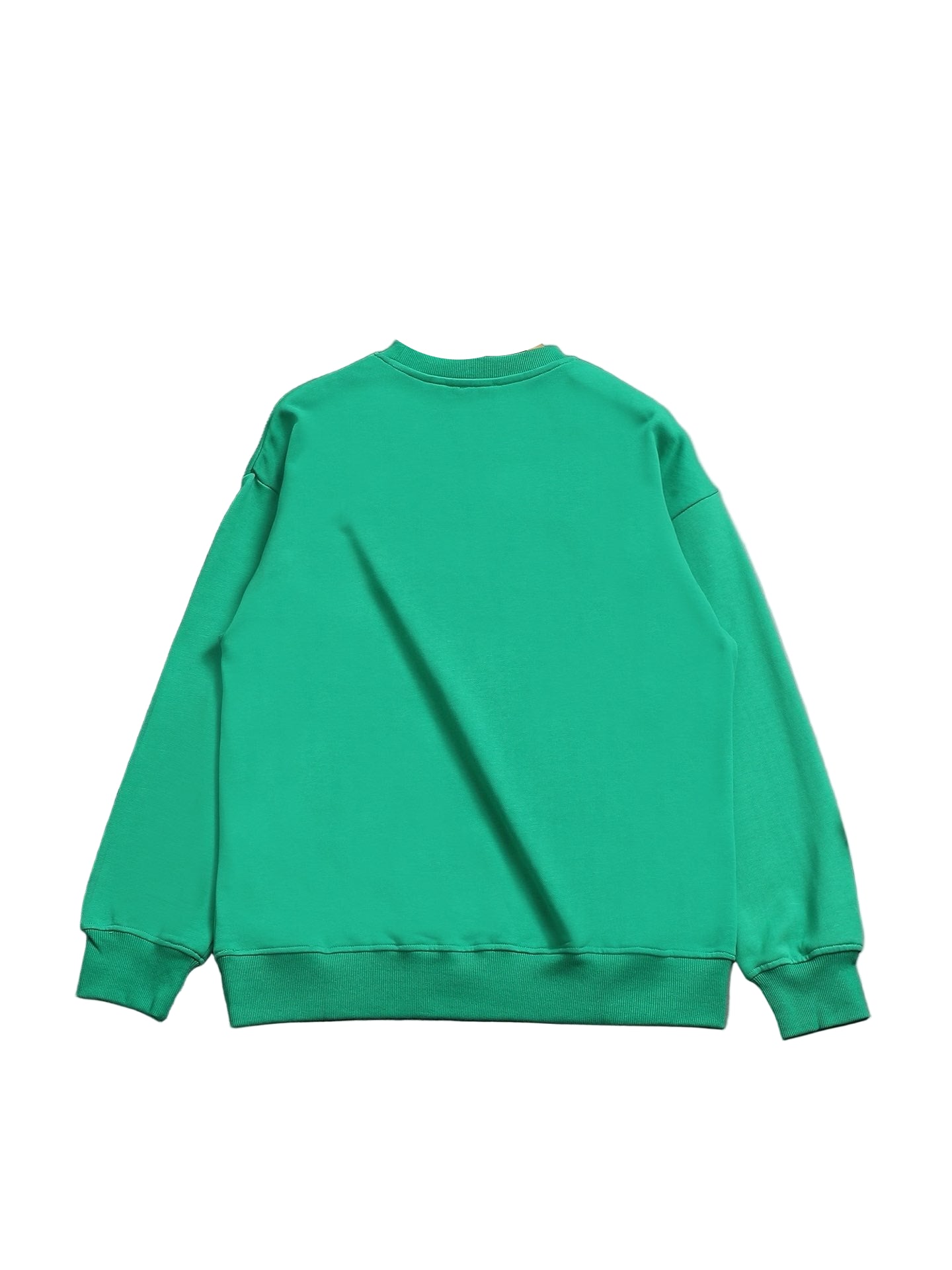 Green sweatshirt on a hanger against a gray background