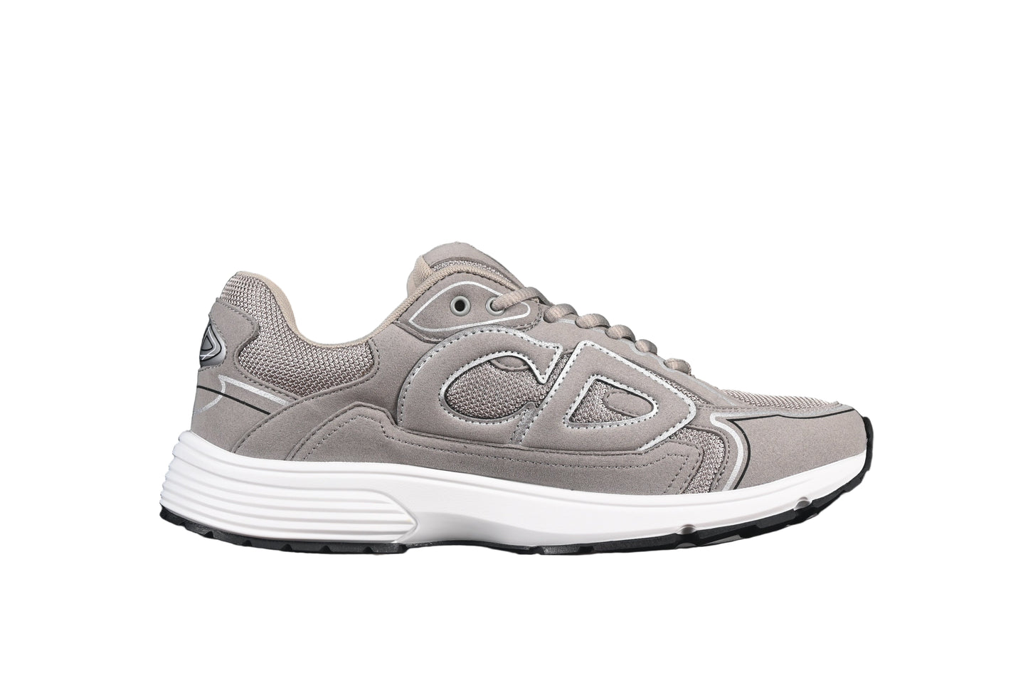 Gray sneaker with white sole on a black background