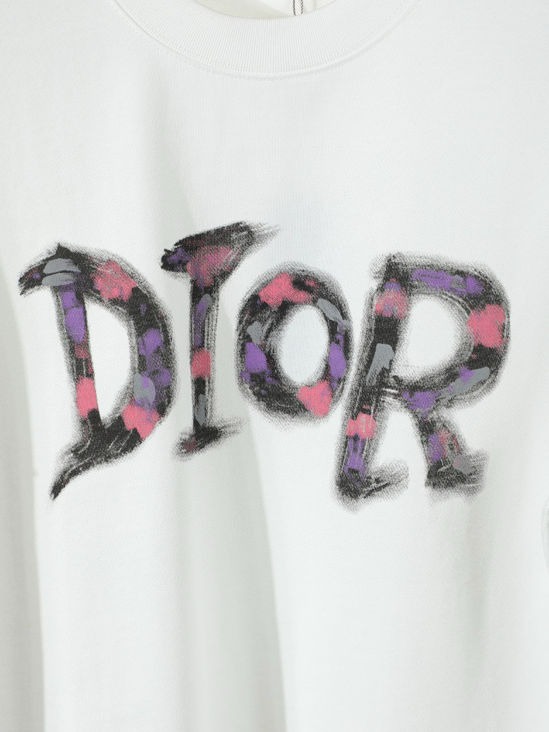 Black or White Distressed Letter Graphic T-Shirt with Color Accents