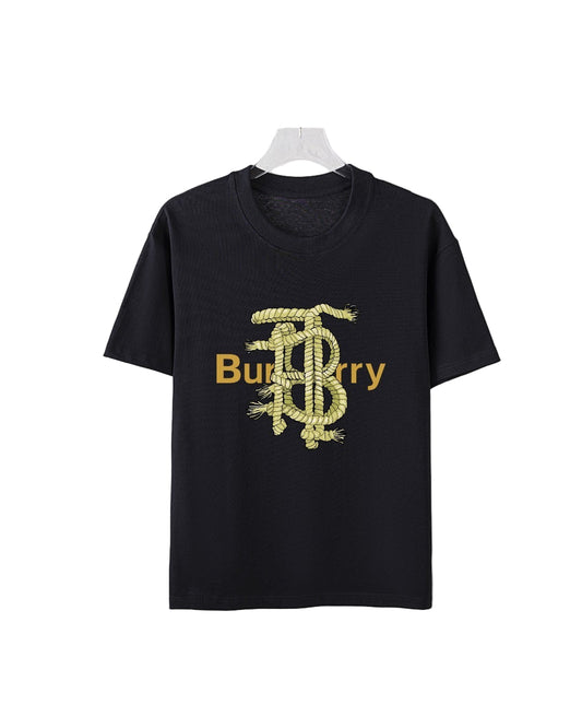 Black t-shirt with gold grsphic on a textured white background