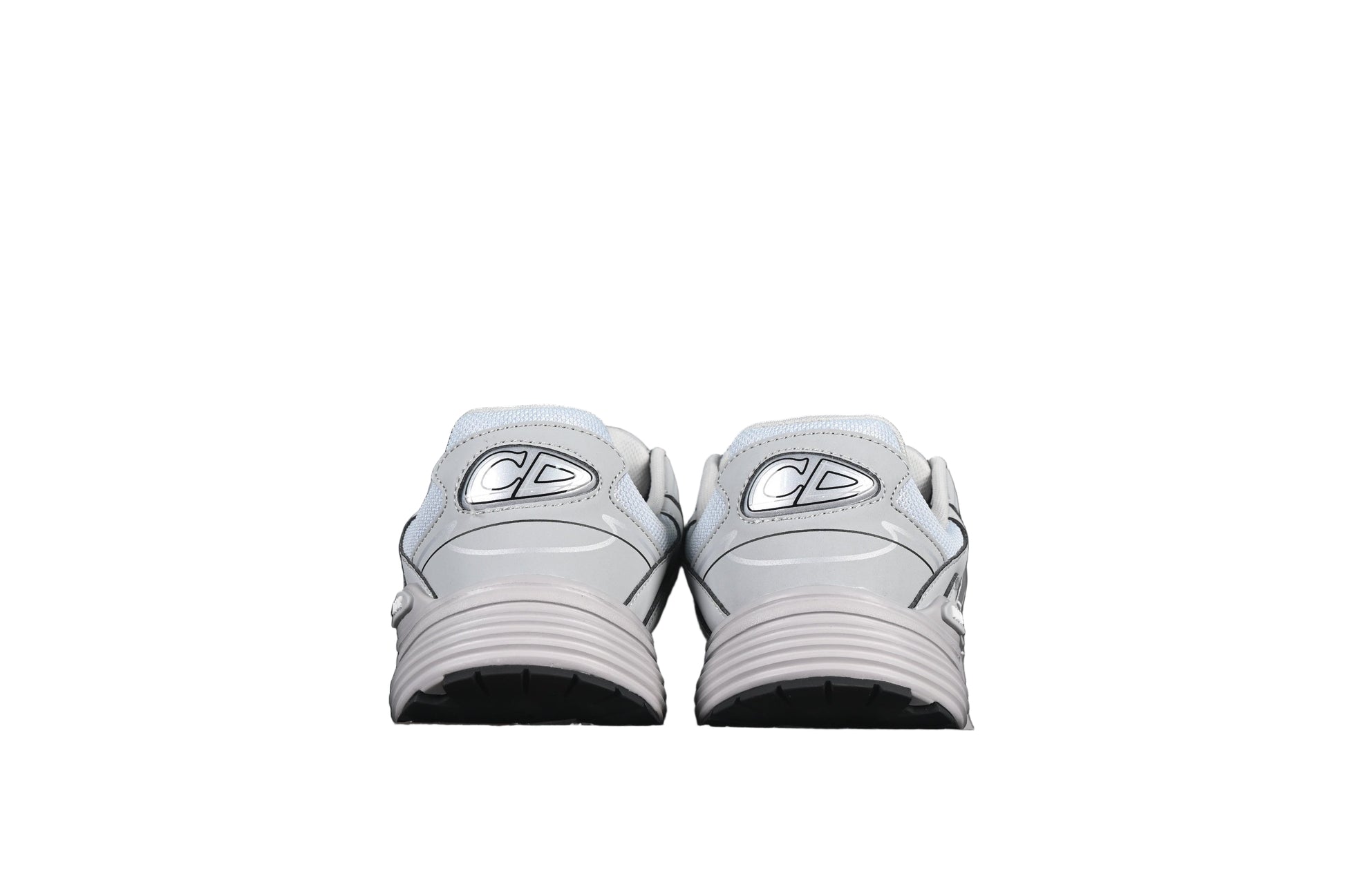 Pair of gray sneakers on a black background