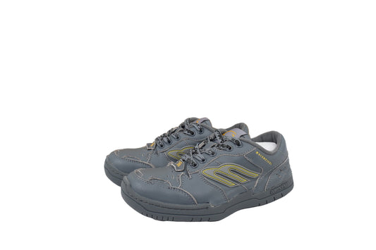 Pair of gray sneakers with green accents on a white background